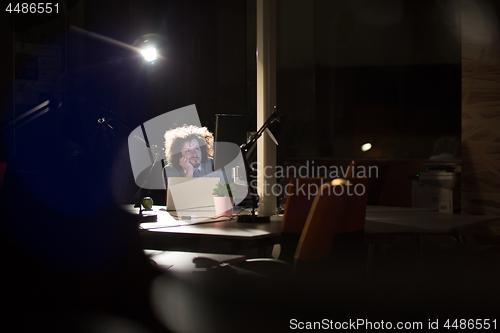 Image of businessman relaxing at the desk