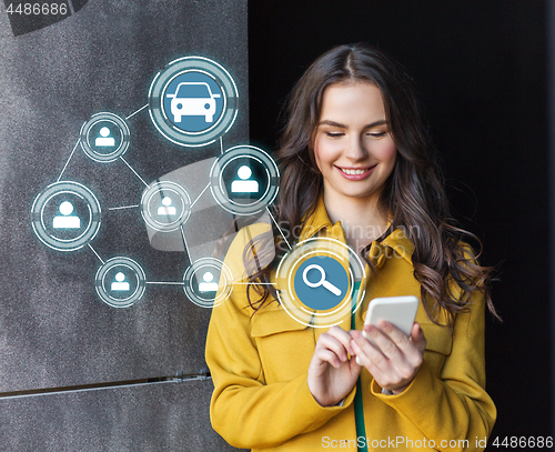 Image of teenage girl using car sharing app on smartphone