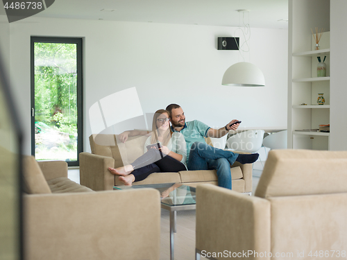 Image of couple relaxes in the living room