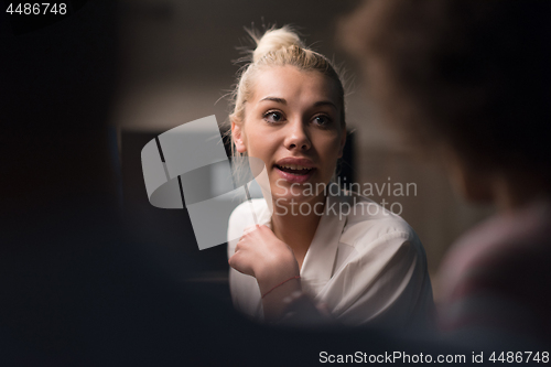 Image of Multiethnic startup business team in night office