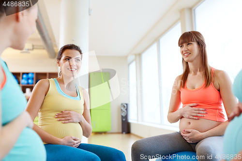 Image of pregnant women sitting on exercise balls in gym