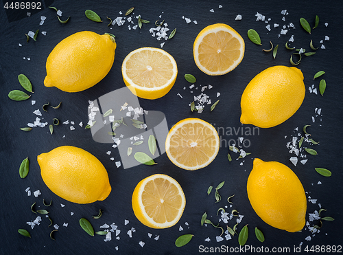 Image of Lemons and salt on dark background