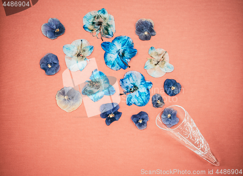 Image of Blue pansies in a glass cone