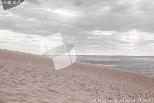 Image of Sea and beach on a calm cloudy day