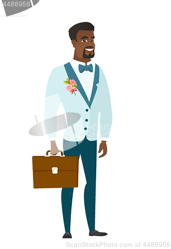 Image of African-american groom holding briefcase.