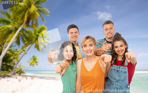 Image of friends pointing at you over tropical beach