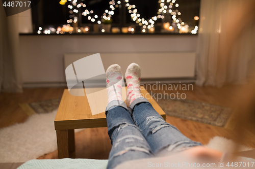 Image of close up of female feet at home on christmas