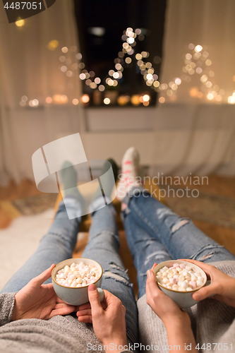 Image of close up of couple drinking hot chocolate at home