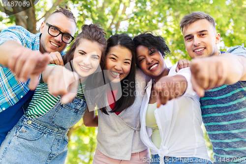 Image of happy international friends hugging in park