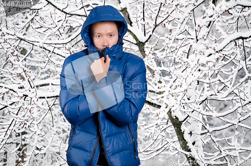 Image of Sad Asian man in Blue