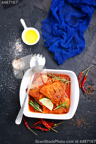 Image of fish with tomato sauce 