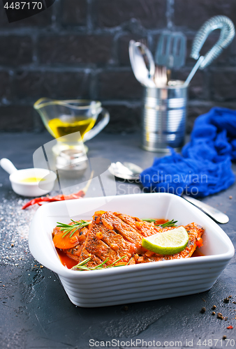 Image of fish with tomato sauce 