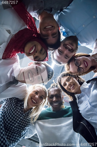 Image of multiethnic Group of young business people celebrating success