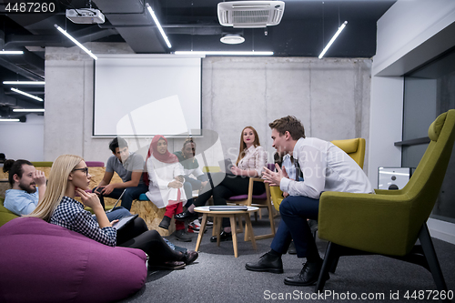 Image of Multiethnic startup business team having meeting