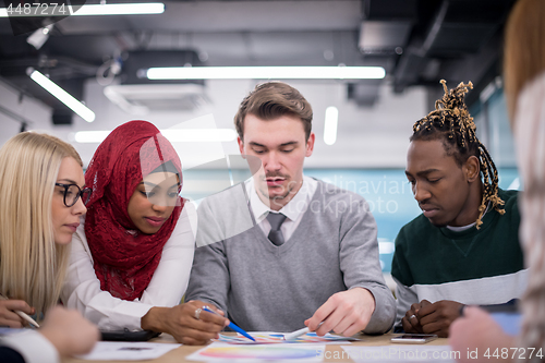 Image of Multiethnic startup business team having meeting