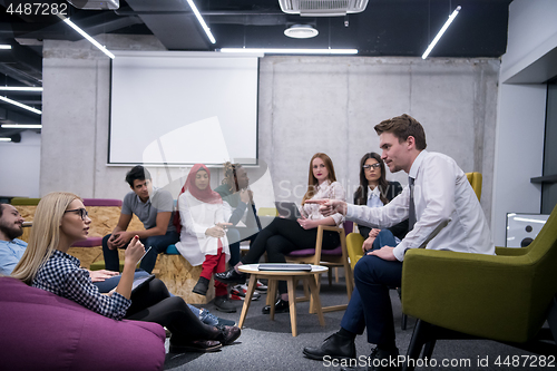 Image of Multiethnic startup business team having meeting