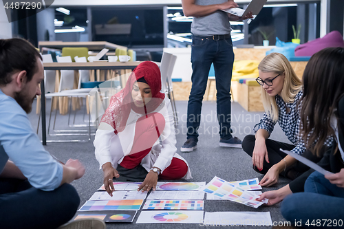 Image of black muslim woman having meeting with Multiethnic  startup busi