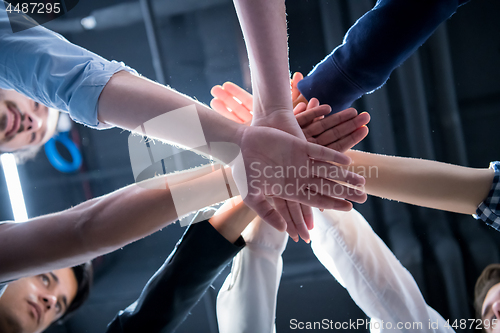 Image of multiethnic Group of young business people celebrating success