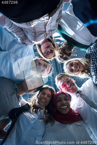 Image of multiethnic Group of young business people celebrating success