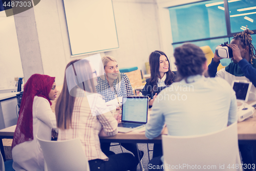 Image of Young Multiethnic Business team using virtual reality headset