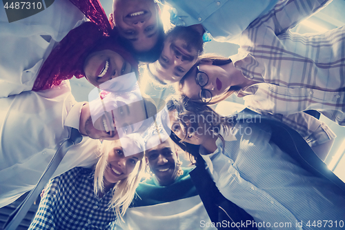 Image of multiethnic Group of young business people celebrating success