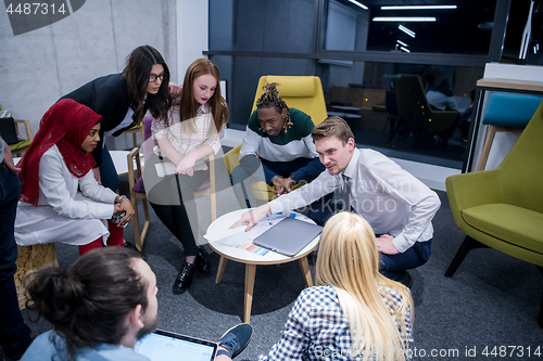 Image of Multiethnic startup business team having meeting