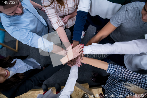 Image of multiethnic Group of young business people celebrating success