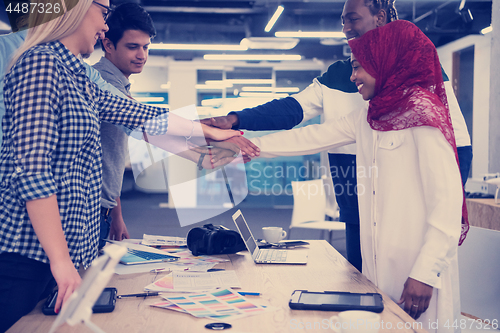 Image of multiethnic Group of young business people celebrating success