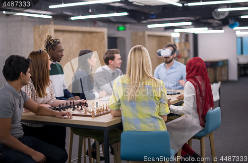 Image of Young Multiethnic Business team using virtual reality headset