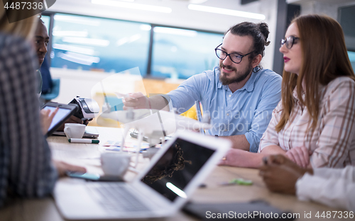 Image of multiethnic business team learning about drone technology