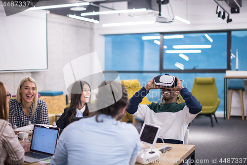 Image of Young Multiethnic Business team using virtual reality headset