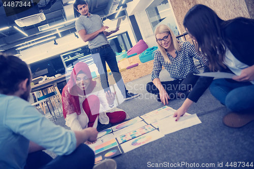 Image of black muslim woman having meeting with Multiethnic  startup busi