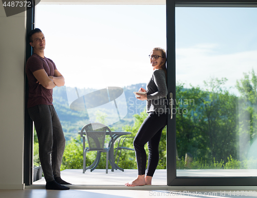 Image of couple on the door of their luxury home villa