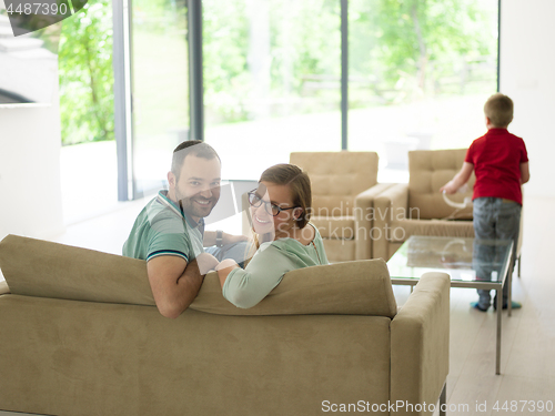 Image of family with little boy enjoys in the modern living room