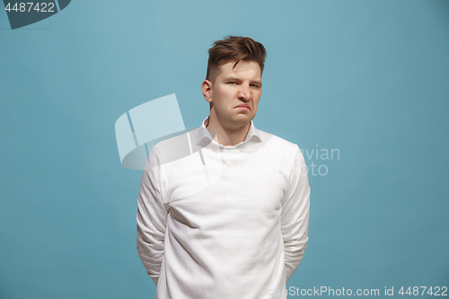 Image of Beautiful bored man isolated on studio background