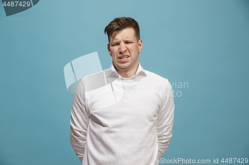 Image of Beautiful bored man isolated on studio background