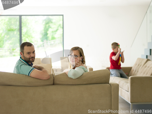 Image of family with little boy enjoys in the modern living room