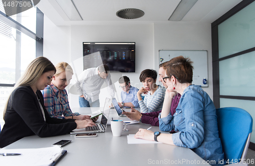 Image of Group of young people meeting in startup office