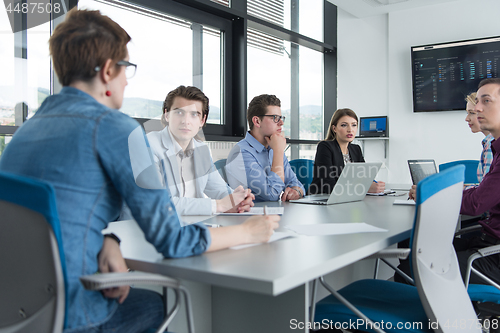 Image of Business Team At A Meeting at modern office building