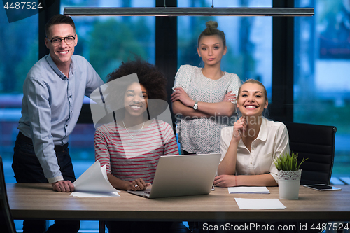 Image of Multiethnic startup business team in night office