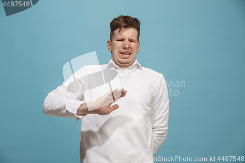 Image of Let me think. Doubtful pensive man with thoughtful expression making choice against studio background