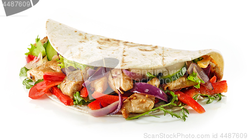 Image of Tortilla wrap with fried chicken meat and vegetables