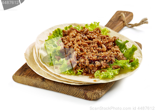 Image of Tortilla wrap with fried minced meat 