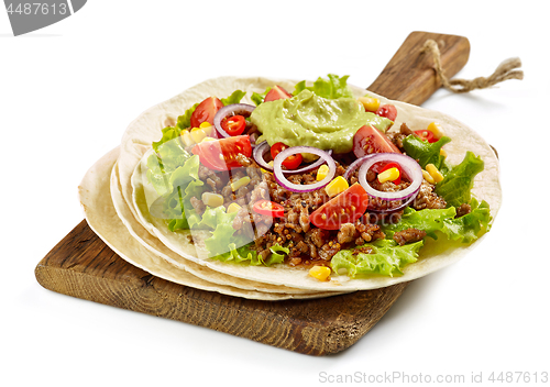 Image of Tortilla wrap with fried minced meat and vegetables