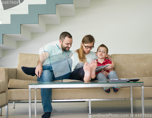 Image of family with little boy enjoys in the modern living room