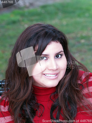 Image of Large attractive woman portrait outdoors red top