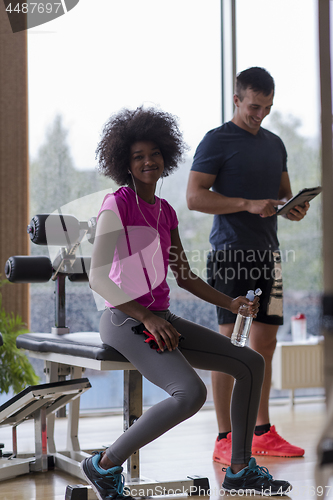 Image of couple in a gym have break