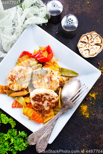 Image of baked vegetables with cutlet