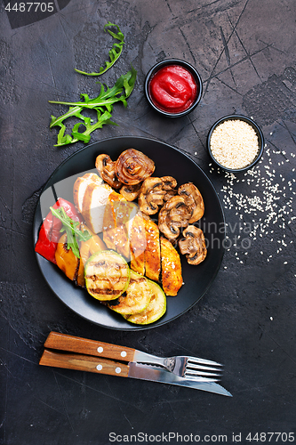 Image of chicken meat with grilled vegetables