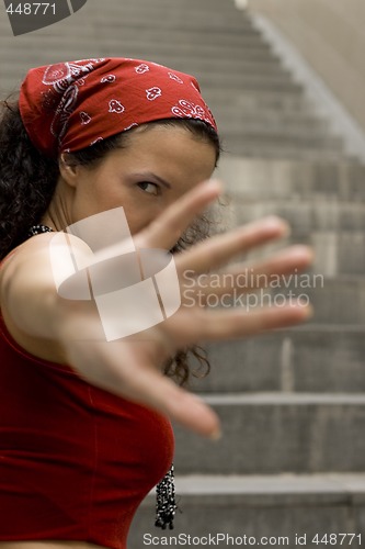 Image of woman in red hides her face